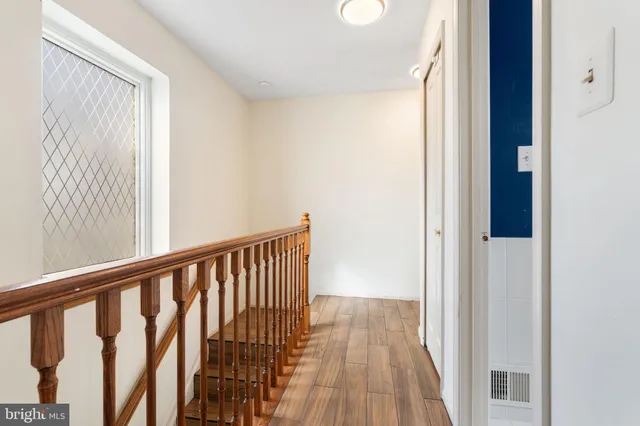 a view of a wooden floor and a window