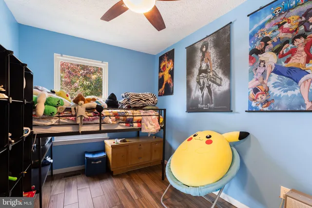 a view of a room with wooden floor and closet
