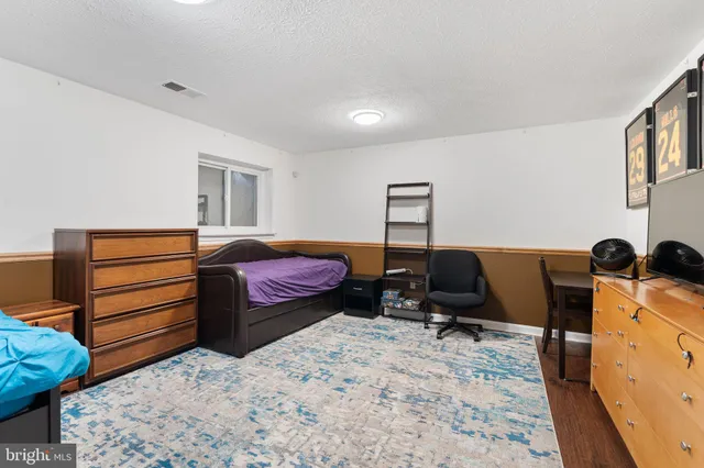 a living room with furniture and flat screen tv