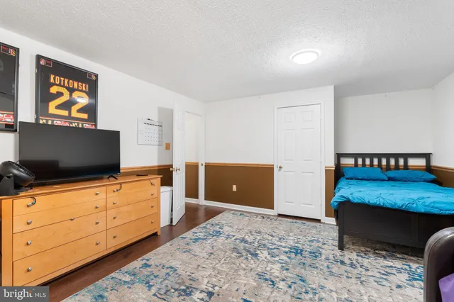 a room with furniture and wooden floor