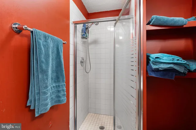 a bathroom with a toilet sink and a mirror