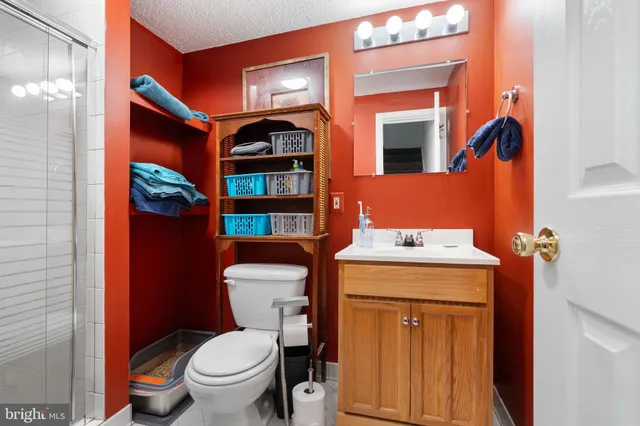 a view of backyard with table and chairs and wooden fence