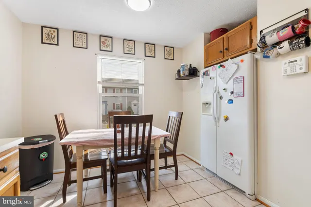 a view of a dining room with furniture and window