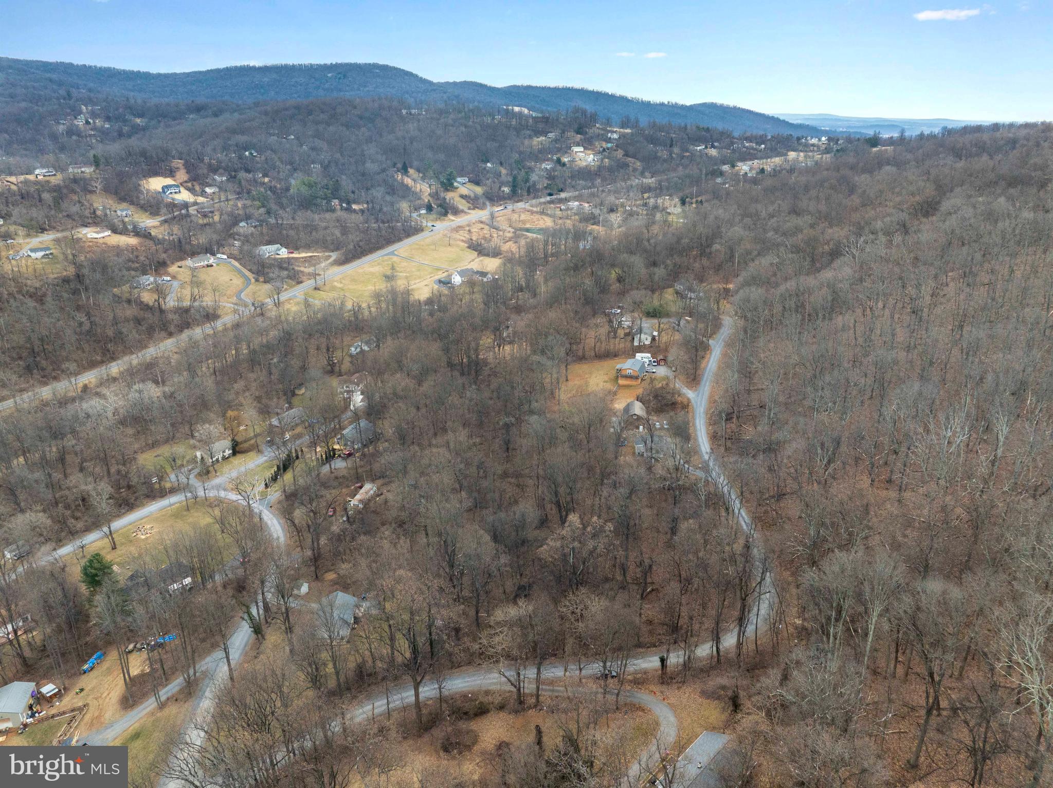 Lot 22 Hickory Tree Road Front Royal, VA 22630 - Photo 20 of 64 a view of a dry yard with mountains in the background