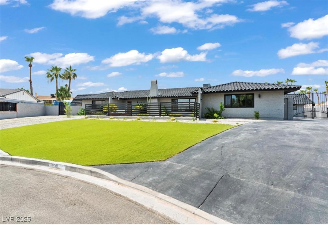4501 South Woodcrest Road Las Vegas, NV 89121 - Photo 2 of 78 View of front of home with a gate and brick siding