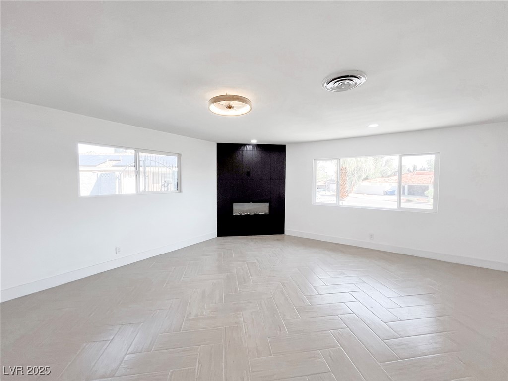 4501 South Woodcrest Road Las Vegas, NV 89121 - Photo 29 of 78 2nd primary bedroom with baseboards and a fireplace