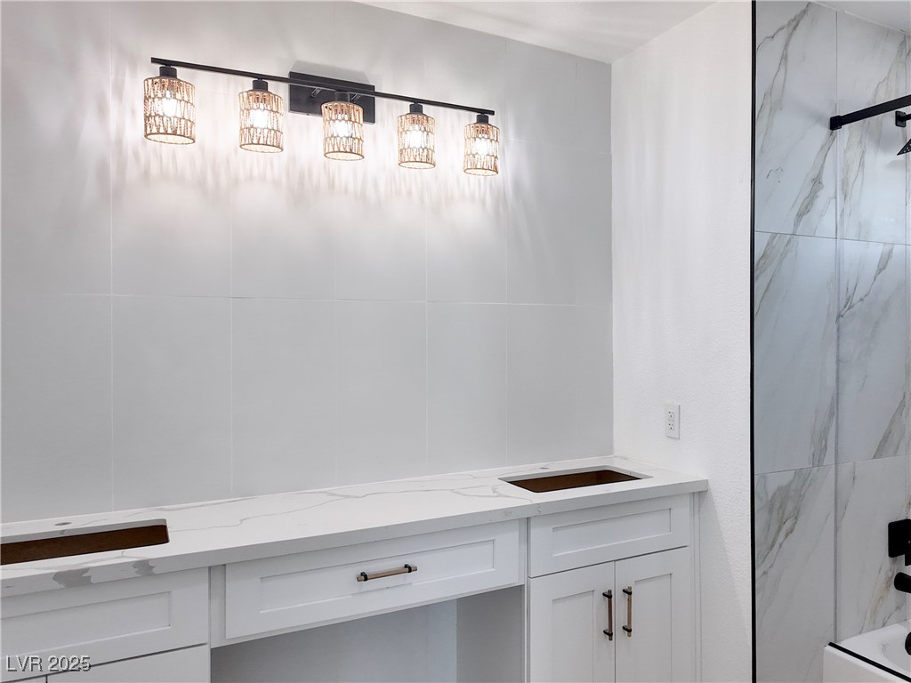 4501 South Woodcrest Road Las Vegas, NV 89121 - Photo 33 of 78 2nd primary Bathroom featuring vanity and shower combination