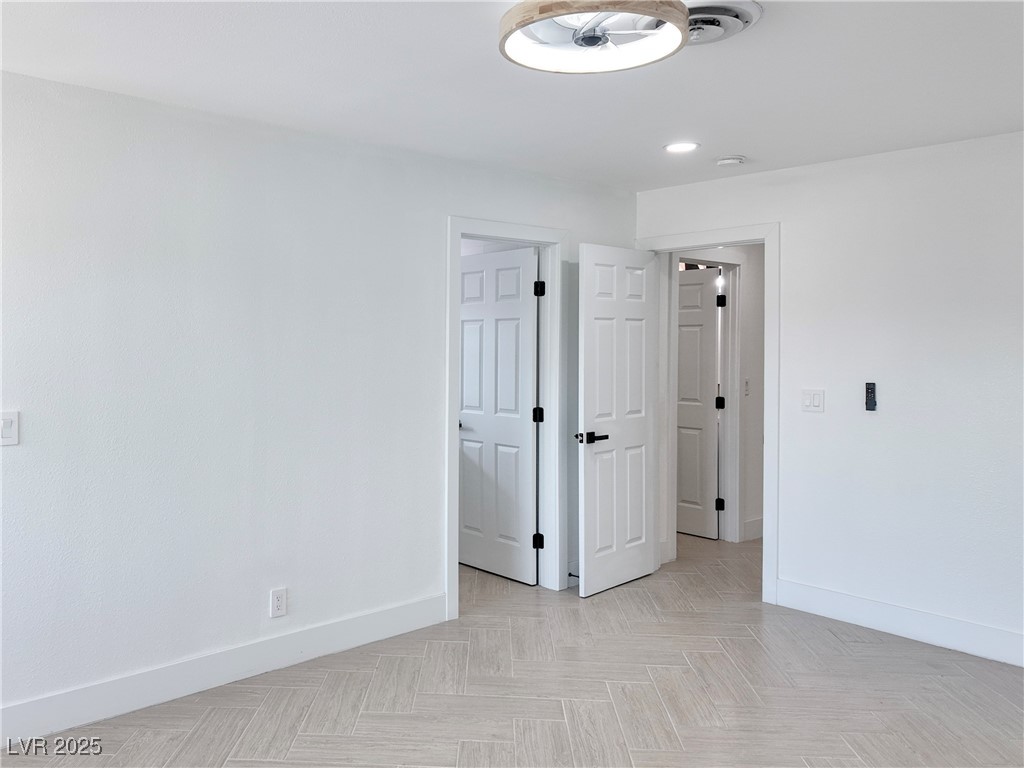 4501 South Woodcrest Road Las Vegas, NV 89121 - Photo 39 of 78 Unfurnished bedroom with baseboards and recessed lighting