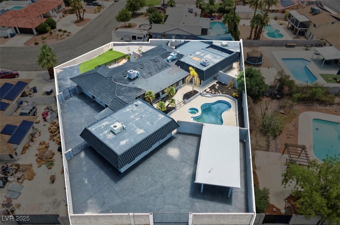 4501 South Woodcrest Road Las Vegas, NV 89121 - Photo 5 of 78 Aerial view of residential area featuring a pool
