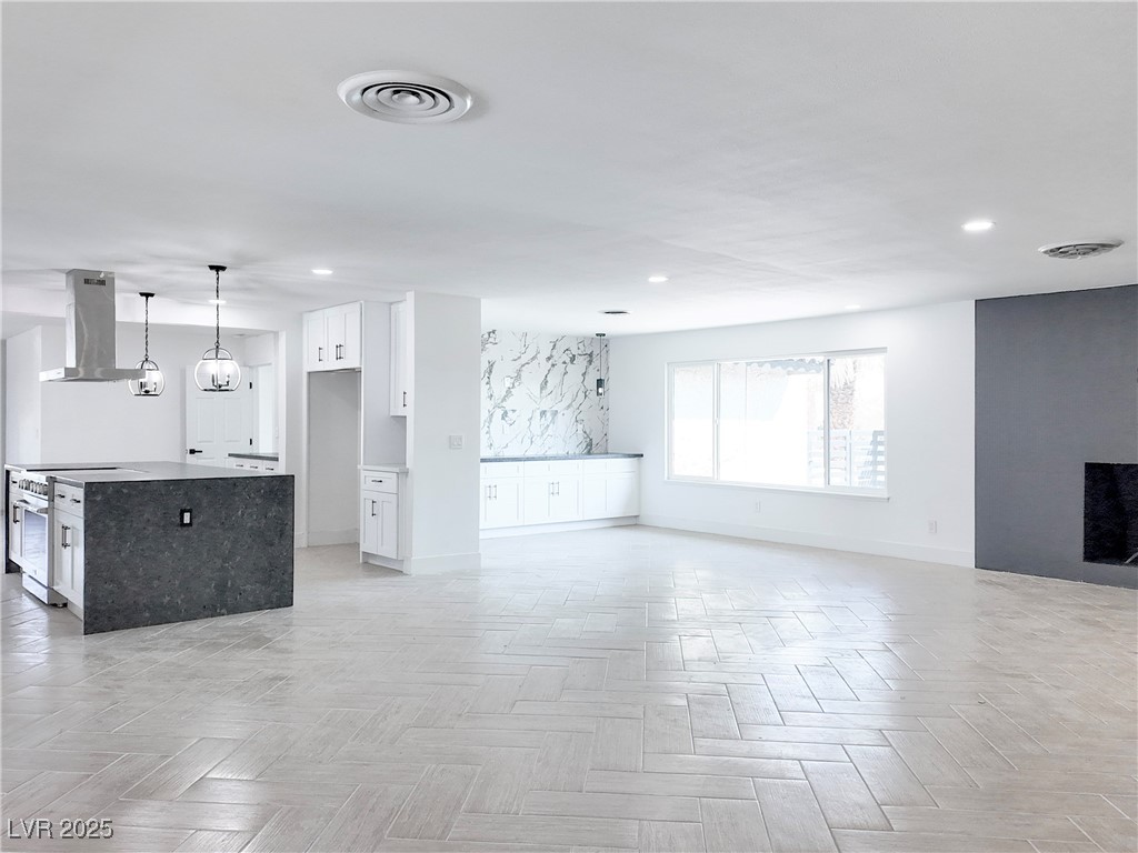 4501 South Woodcrest Road Las Vegas, NV 89121 - Photo 7 of 78 Unfurnished living room with recessed lighting and baseboards
