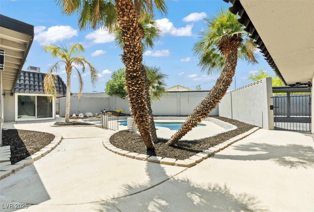 4501 South Woodcrest Road Las Vegas, NV 89121 - Photo 78 of 78 View of swimming pool featuring a fenced backyard and a patio