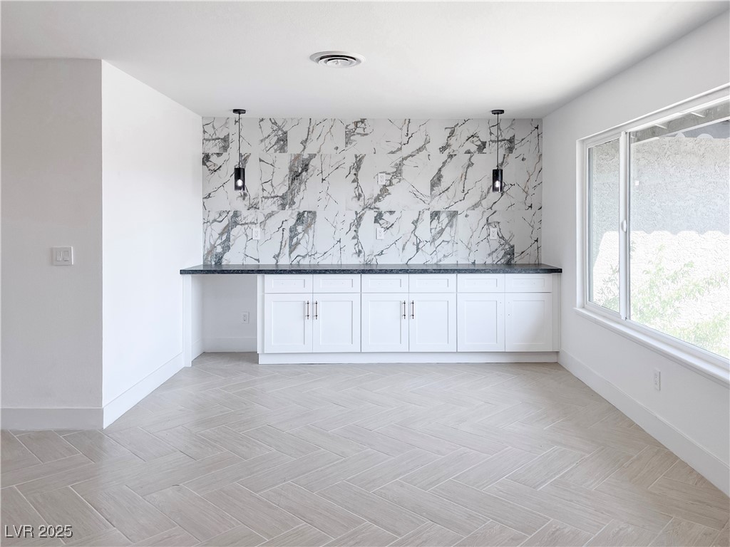 4501 South Woodcrest Road Las Vegas, NV 89121 - Photo 10 of 78 Unfurnished dining area with bar