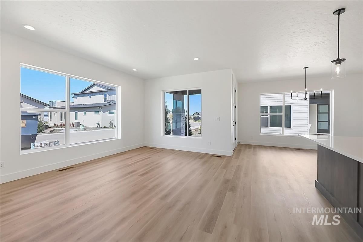 776 South Calhoun Lane Star, ID 83669 - Photo 23 of 49 Spacious open-concept interior featuring light wood-finish flooring and recessed lighting