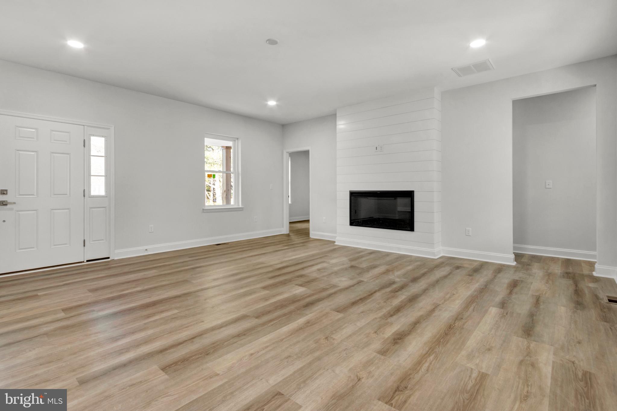 22527 Lawson Road Georgetown, DE 19947 - Photo 12 of 53 an empty room with window and fireplace