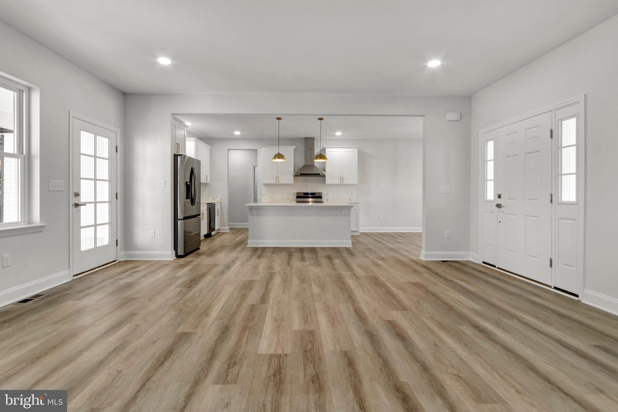 22527 Lawson Road Georgetown, DE 19947 - Photo 13 of 53 a view of a kitchen with a sink and a refrigerator