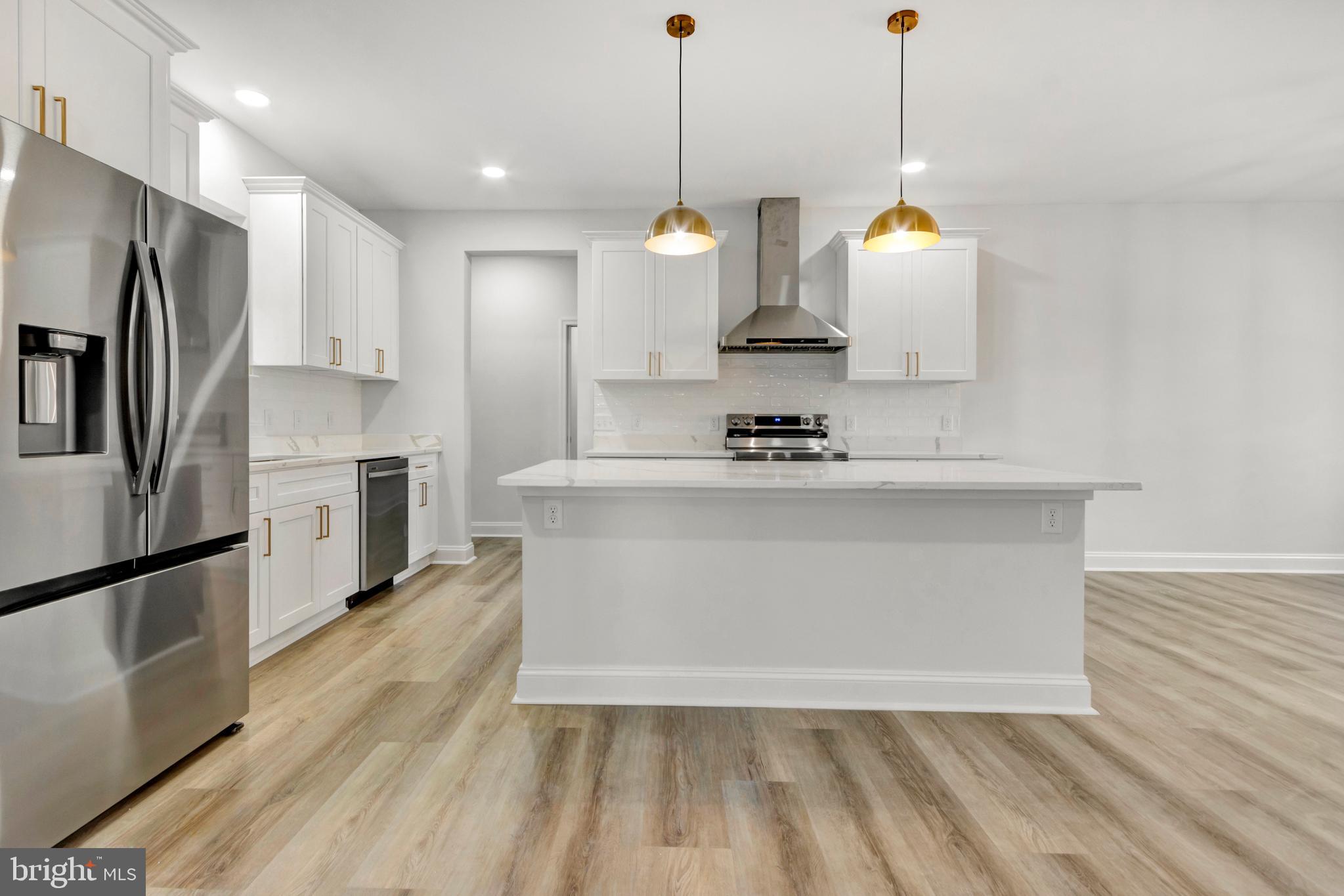 22527 Lawson Road Georgetown, DE 19947 - Photo 14 of 53 a view of a kitchen with stainless steel appliances granite countertop a sink a stove a refrigerator and island