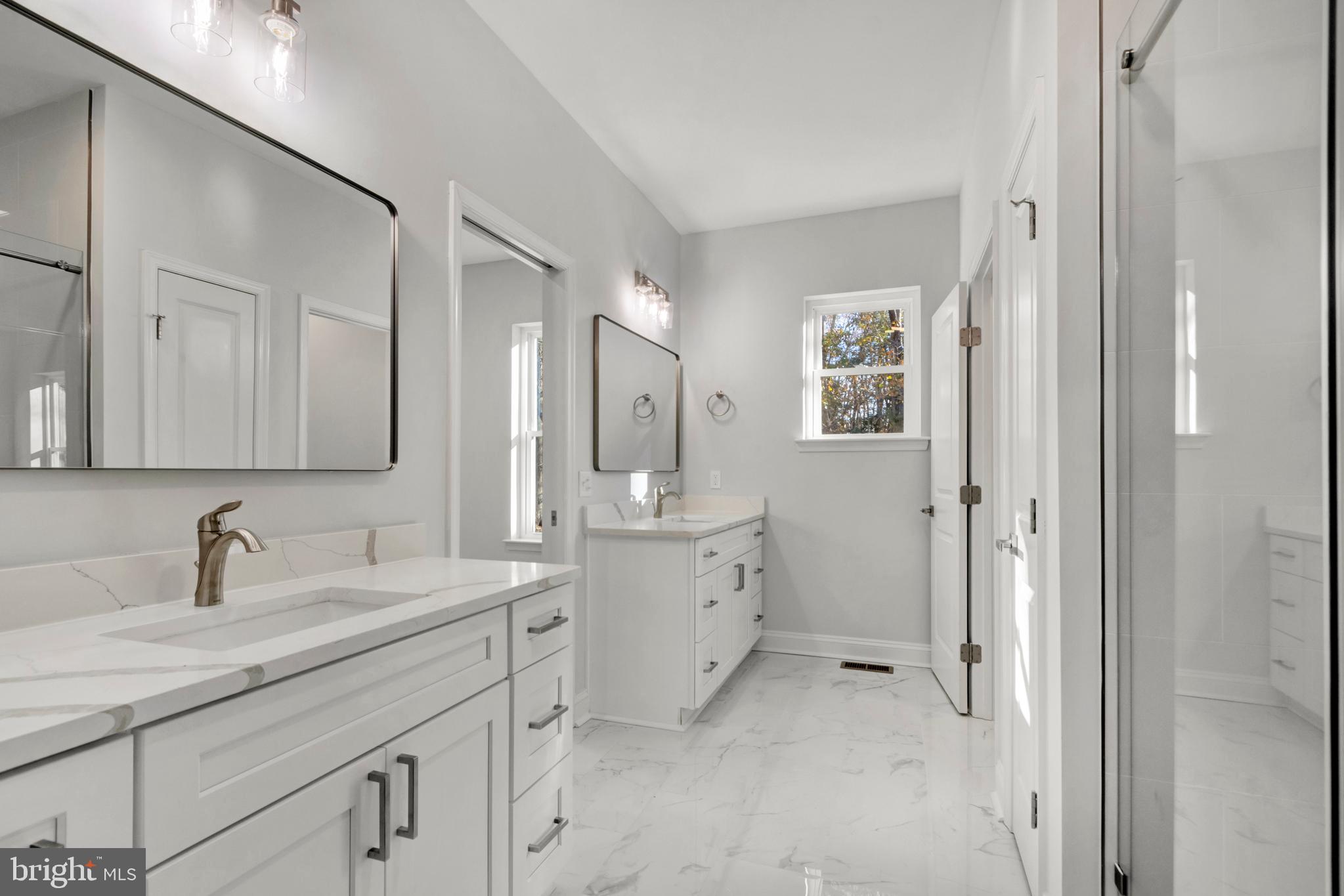 22527 Lawson Road Georgetown, DE 19947 - Photo 30 of 53 a bathroom with a double vanity sink mirror and double
