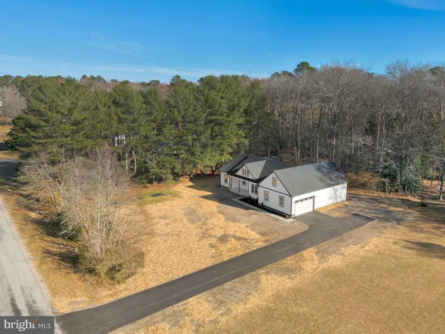 a view of a backyard with a sitting area