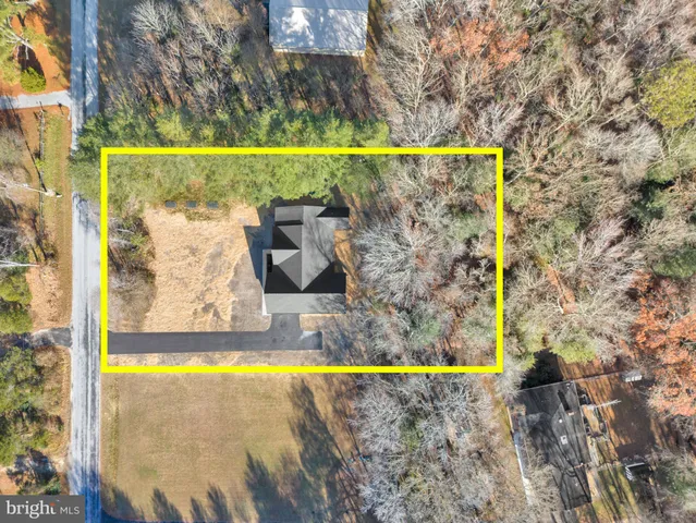 a view of a swimming pool with a yard