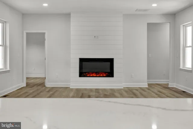 an empty room with fireplace