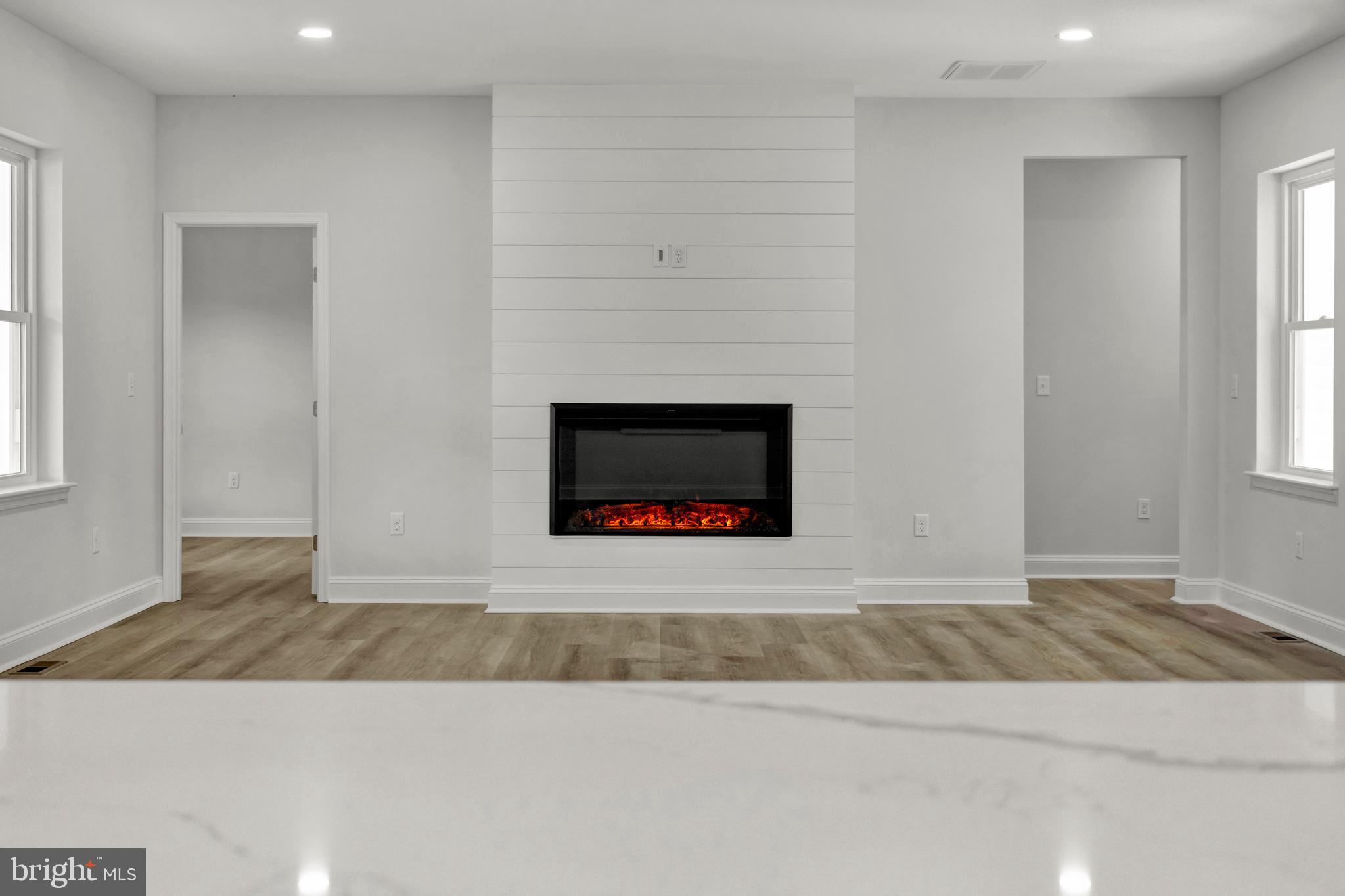 22527 Lawson Road Georgetown, DE 19947 - Photo 10 of 53 an empty room with fireplace