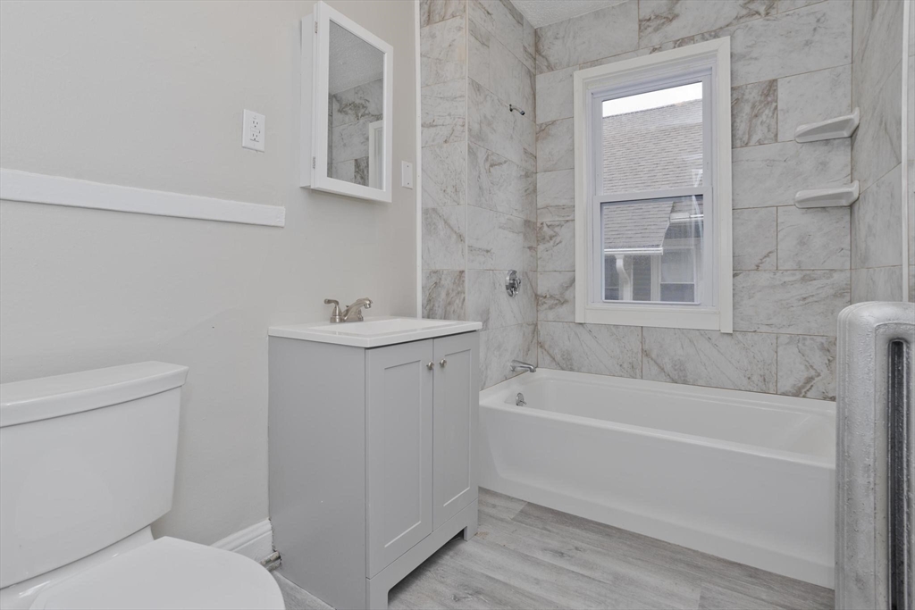 107 Orange Street Springfield, MA 01108 - Photo 17 of 38 a bathroom with a sink a toilet and shower