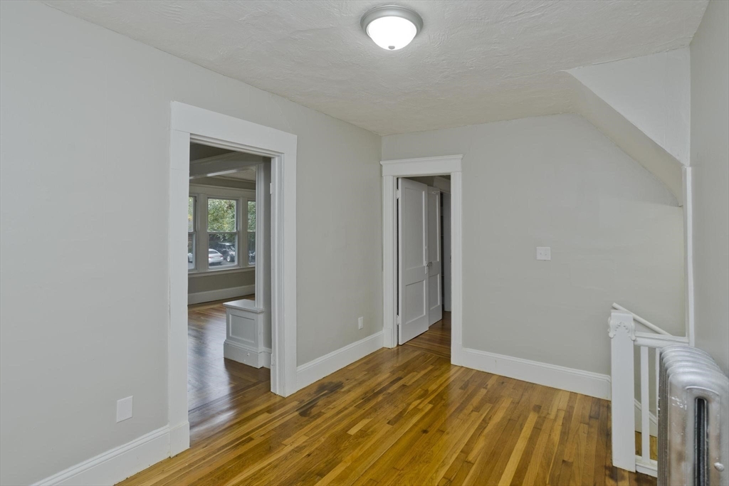 107 Orange Street Springfield, MA 01108 - Photo 3 of 38 a view of empty room with wooden floor