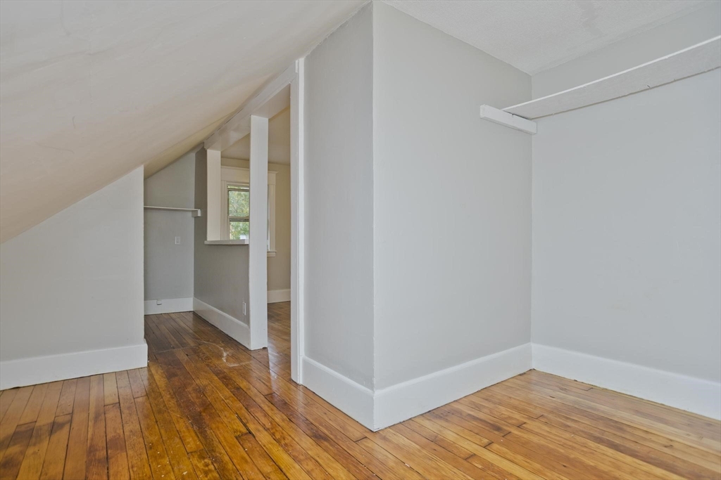 107 Orange Street Springfield, MA 01108 - Photo 36 of 38 a view of hallway with wooden floor