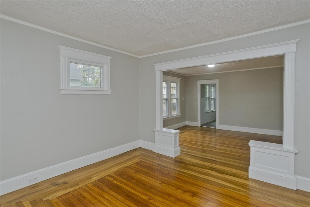 107 Orange Street Springfield, MA 01108 - Photo 5 of 38 a view of empty room with wooden floor