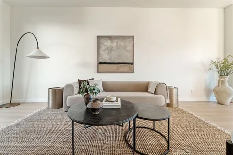 a view of a livingroom with furniture and bathroom