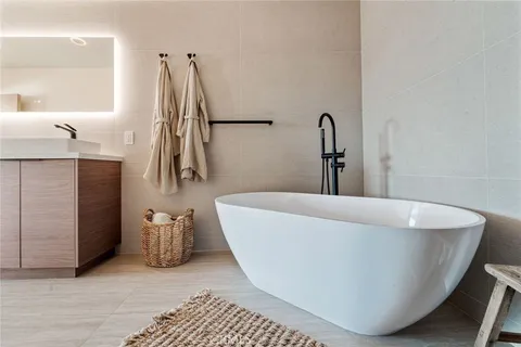 a white bath tub sitting in a bathroom