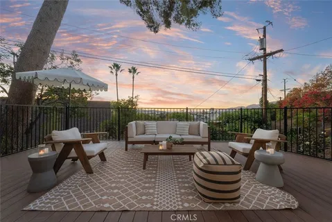 a patio with patio couch and table