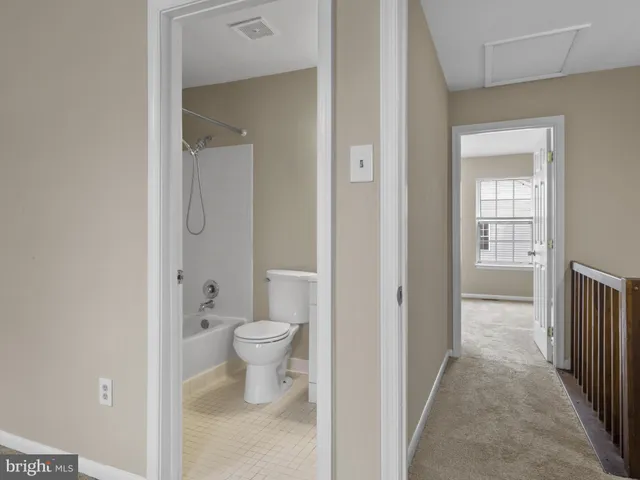 a view of a bathroom from a hallway