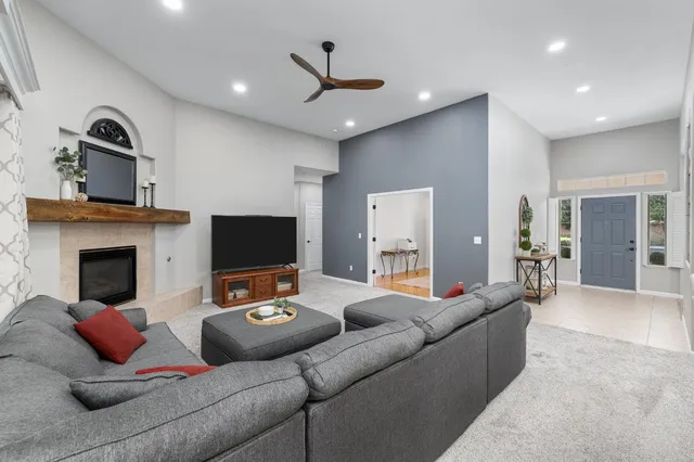 a living room with furniture and a fireplace