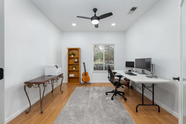 a workspace with furniture and white walls