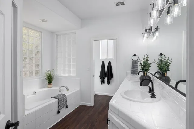 a bathroom with a sink a toilet and bathtub