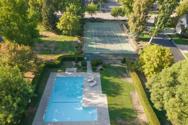 a backyard of a house with yard and outdoor seating