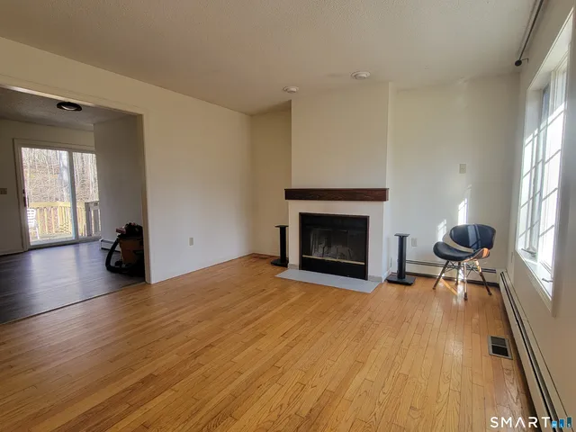 a view of livingroom with furniture and a fireplace
