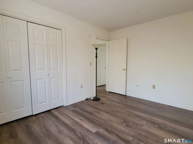 a view of a livingroom with wooden floor