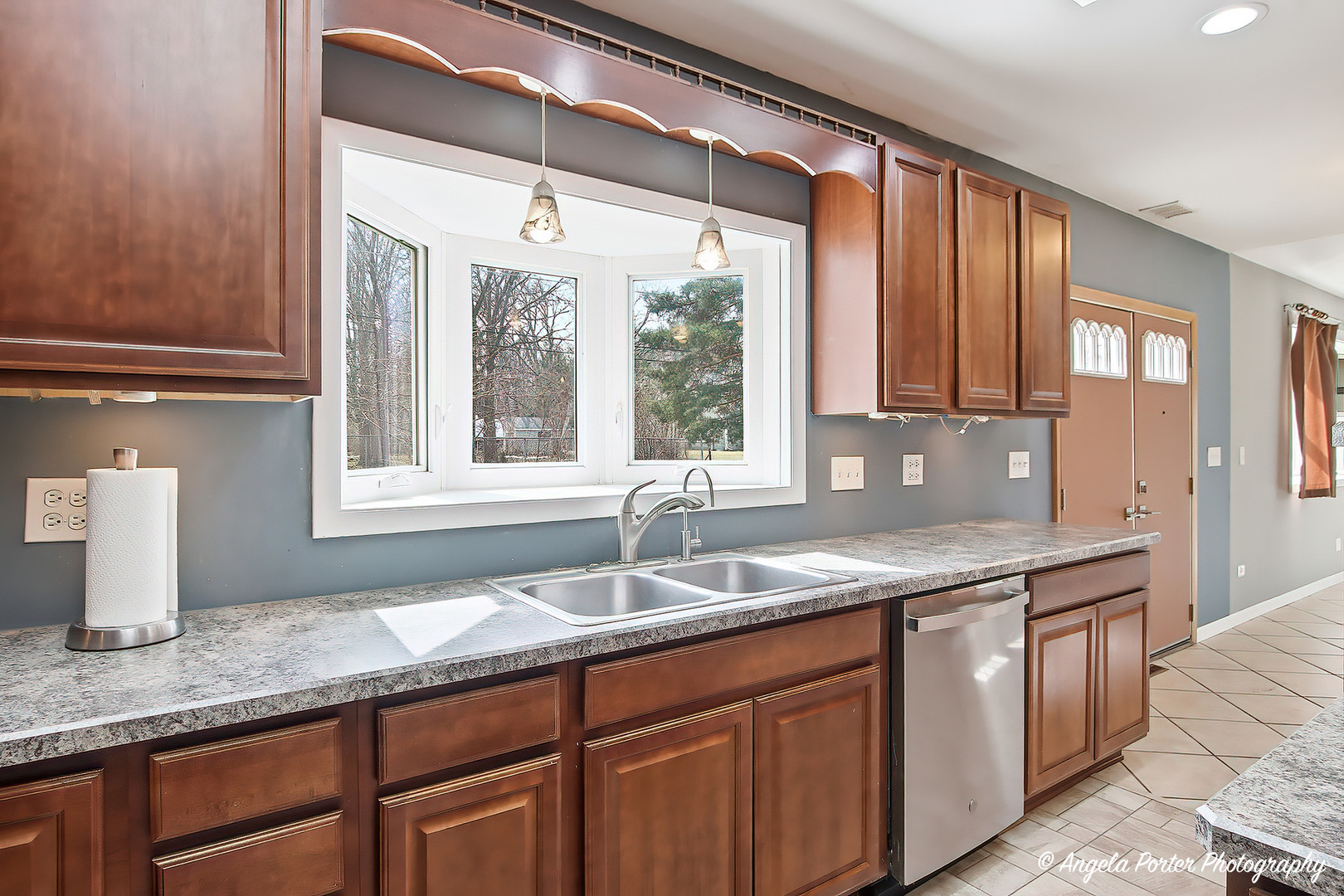 4320 West Lakewood Road McHenry, IL 60050 - Photo 13 of 50 a kitchen with granite countertop a sink and a window