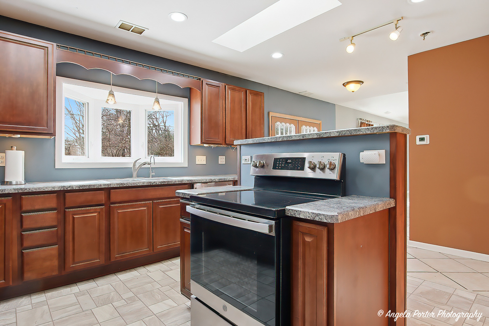 4320 West Lakewood Road McHenry, IL 60050 - Photo 14 of 50 a kitchen with stainless steel appliances granite countertop a sink and a stove