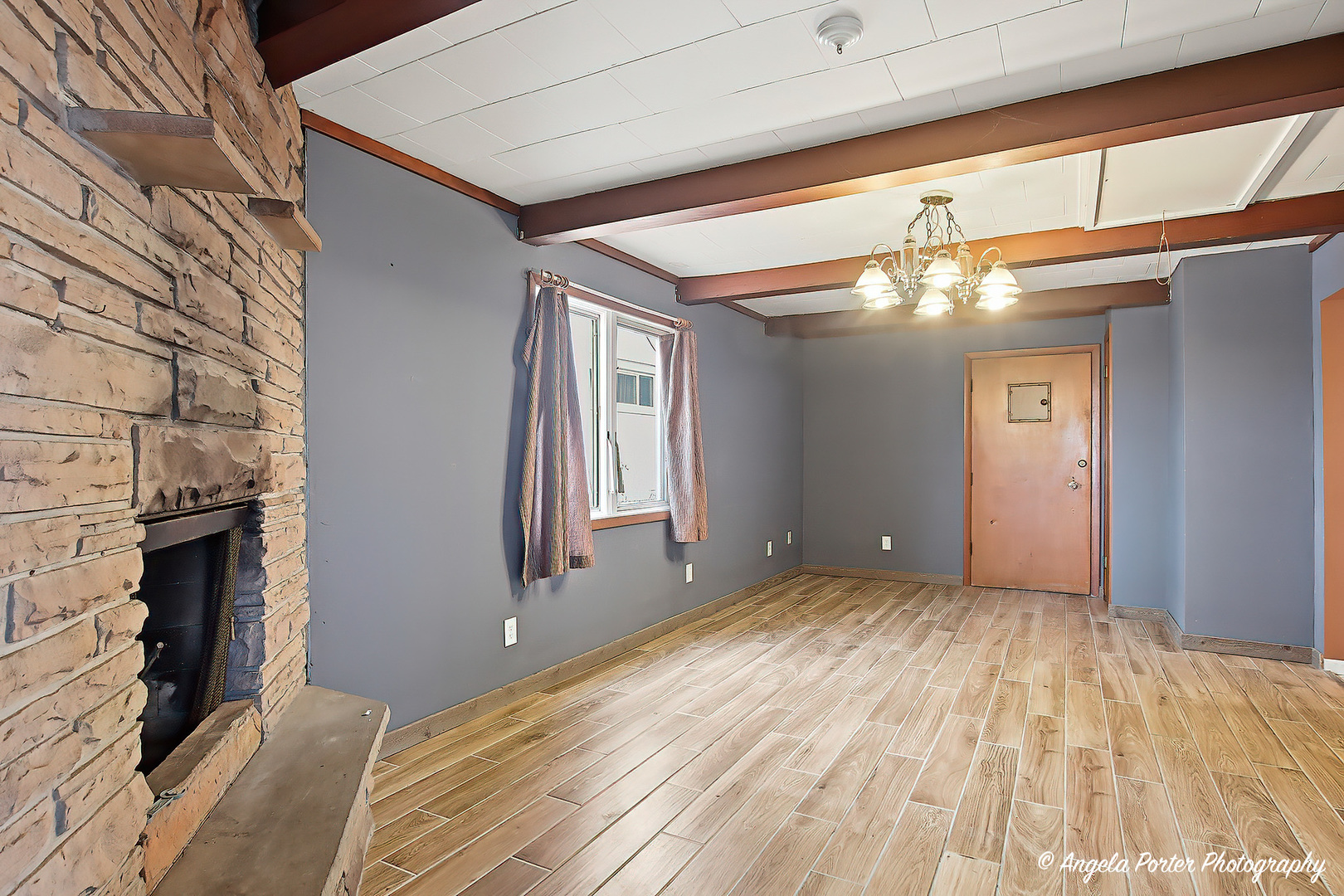 4320 West Lakewood Road McHenry, IL 60050 - Photo 22 of 50 a view of an empty room with wooden floor and a window