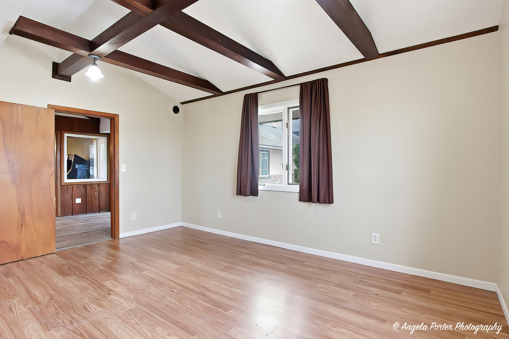 4320 West Lakewood Road McHenry, IL 60050 - Photo 24 of 50 an empty room with wooden floor and windows