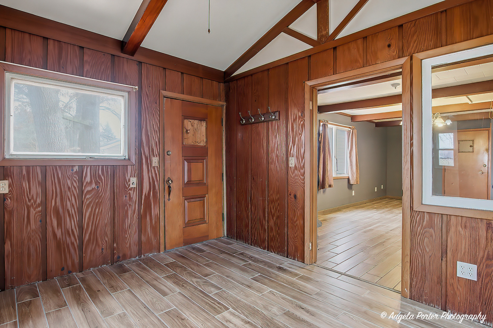 4320 West Lakewood Road McHenry, IL 60050 - Photo 32 of 50 a view of a hallway with wooden floor and entryway