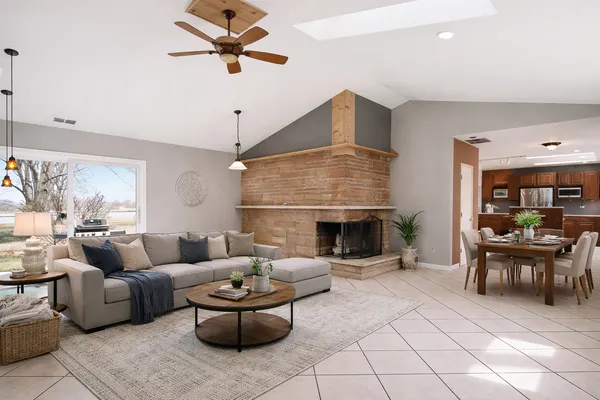 a living room with furniture and a fireplace