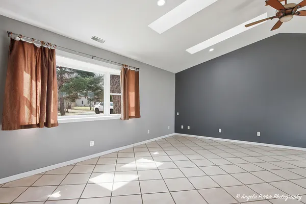 a view of an empty room with a window