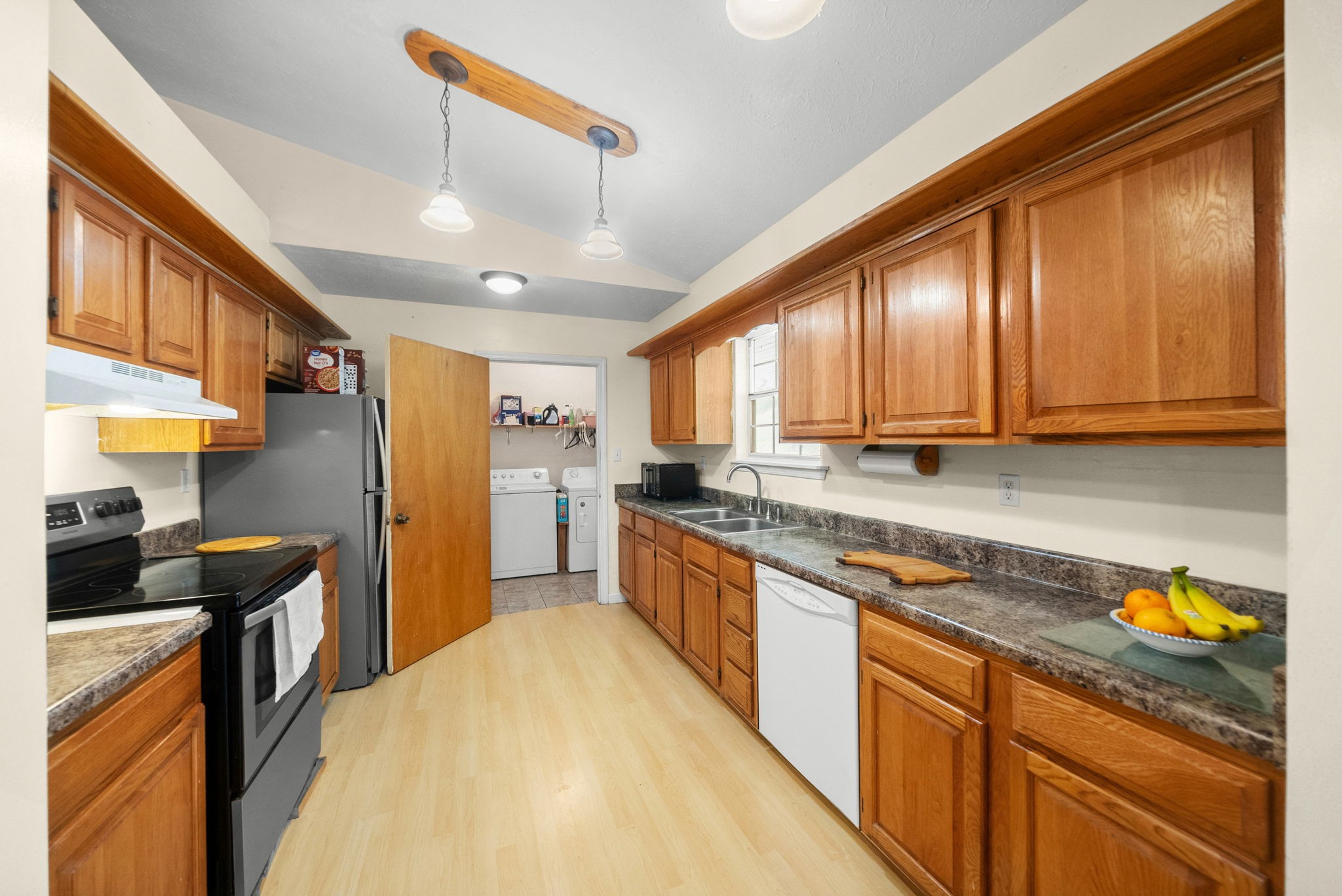3966 Taz Hyde Road Nashville, TN 37218 - Photo 11 of 48 a kitchen with stainless steel appliances granite countertop sink stove refrigerator and cabinets