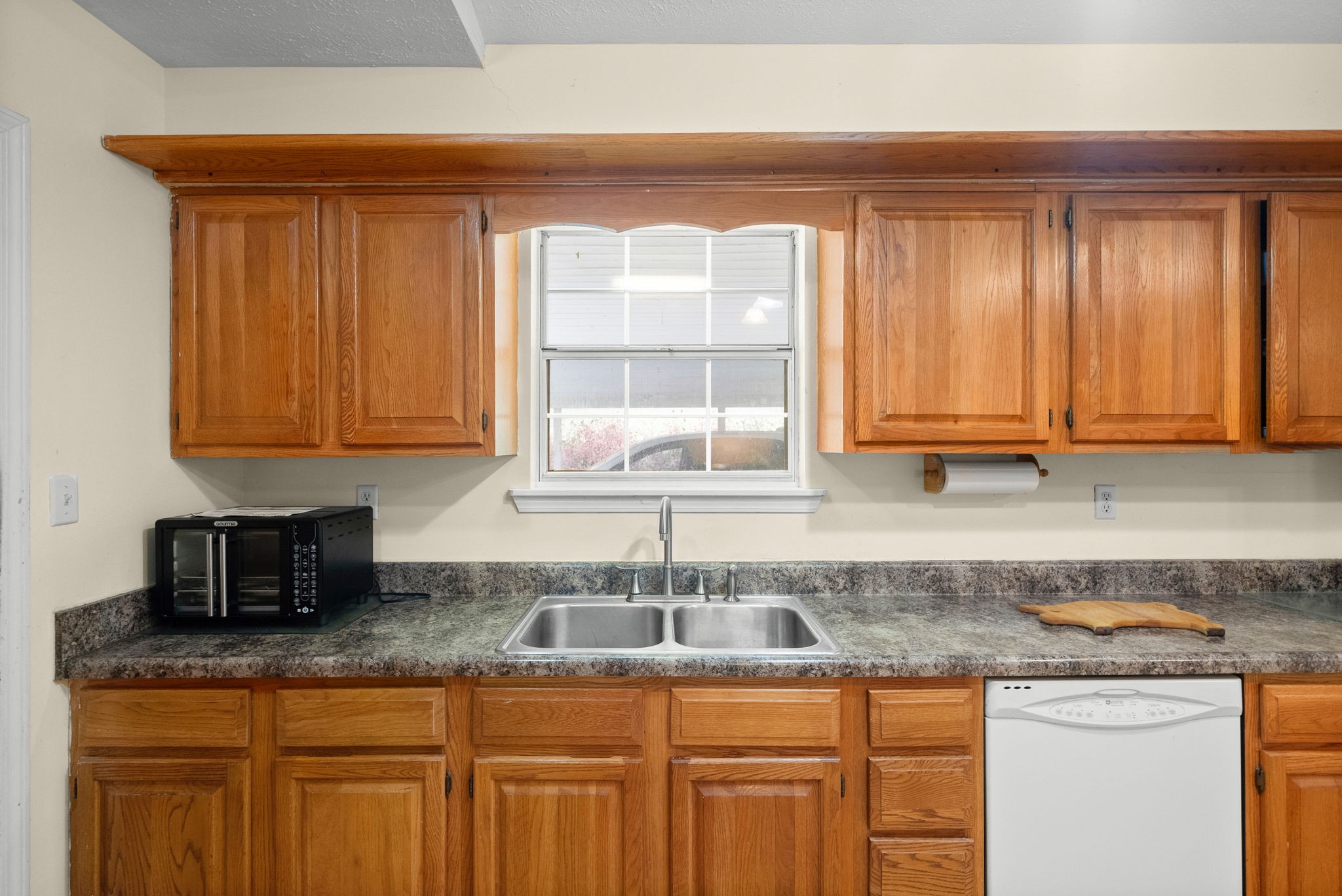 3966 Taz Hyde Road Nashville, TN 37218 - Photo 12 of 48 a kitchen with granite countertop a sink window and cabinets