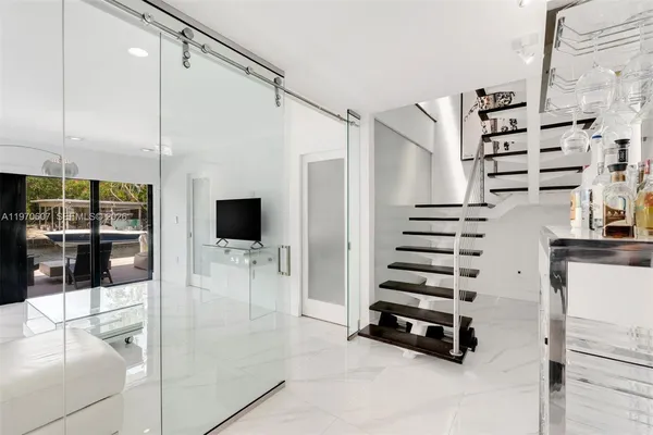 a view of entryway and hall with wooden floor