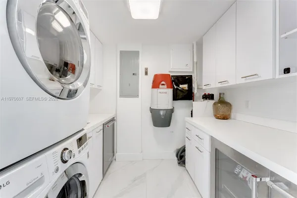a kitchen with a sink and a mirror